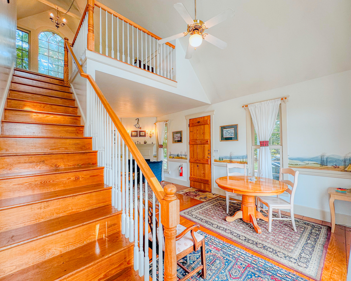 Image of the staircase leading to the upstairs loft of the Carriage Bay Cottage.