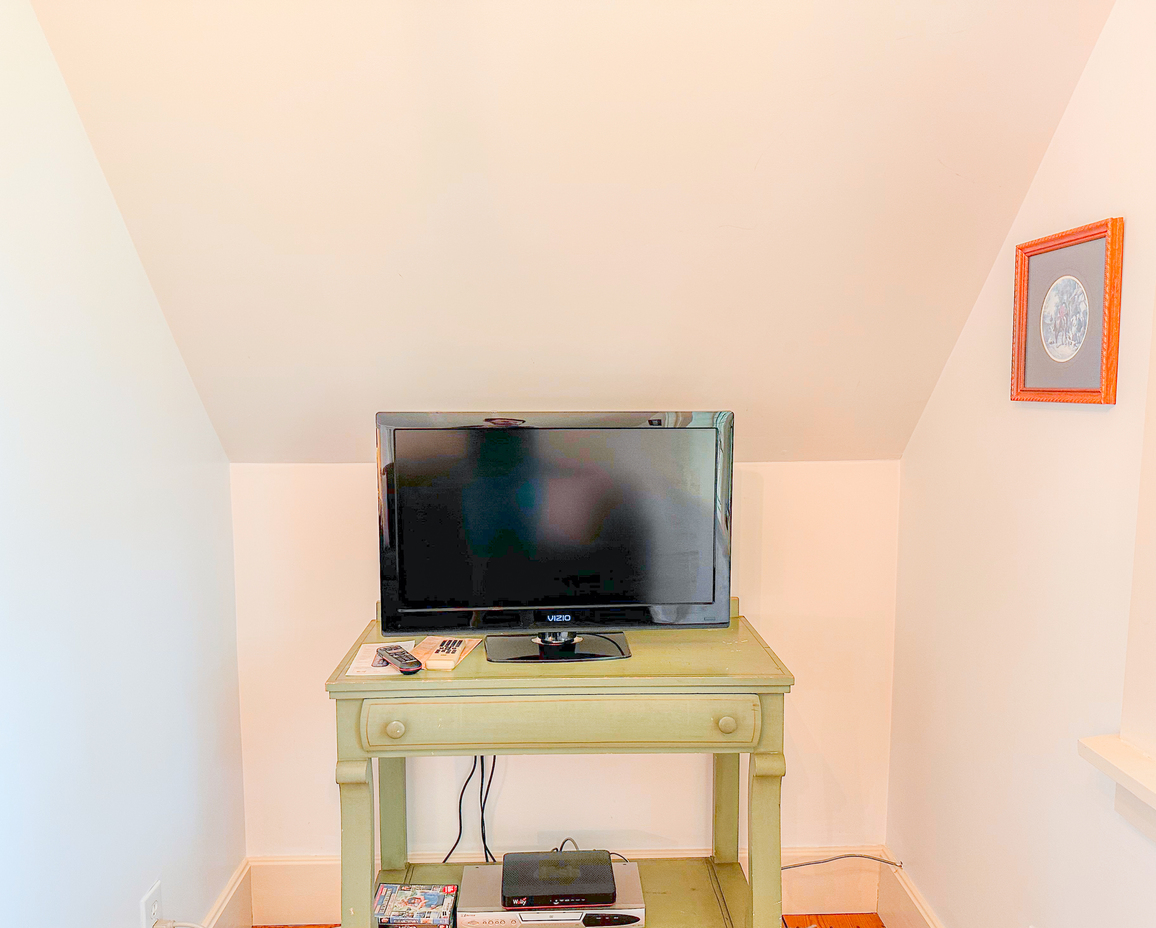 Image of the TV in the upstairs loft of the Carriage Bay Cottage.