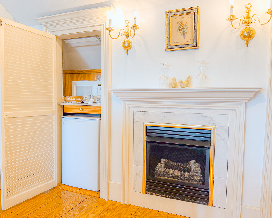 Image of the fireplace and kitchenette in the Croft Room.