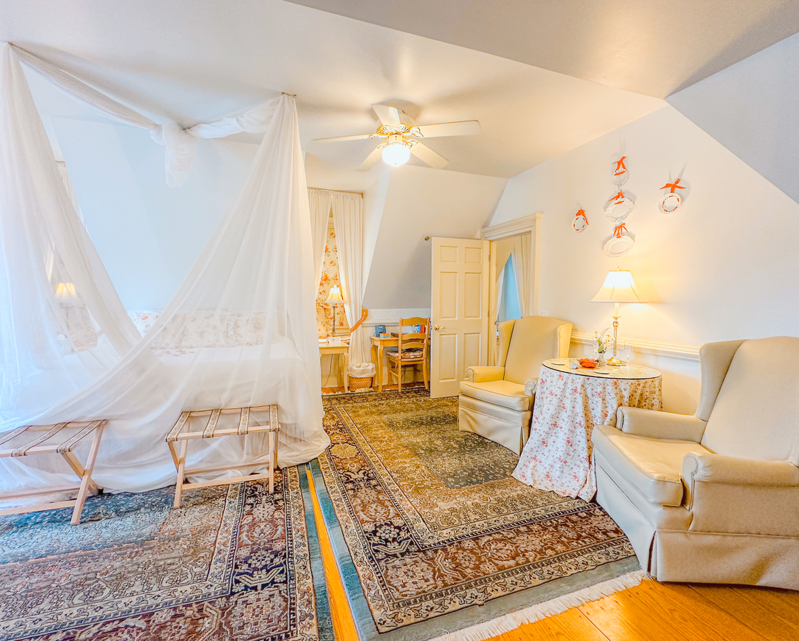 Image of the sitting area and bed in the Dovecote Room.