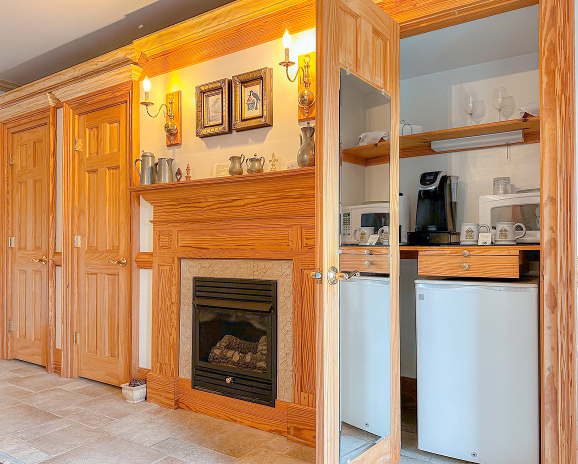 The East Room's fireplace and kitchenette. 